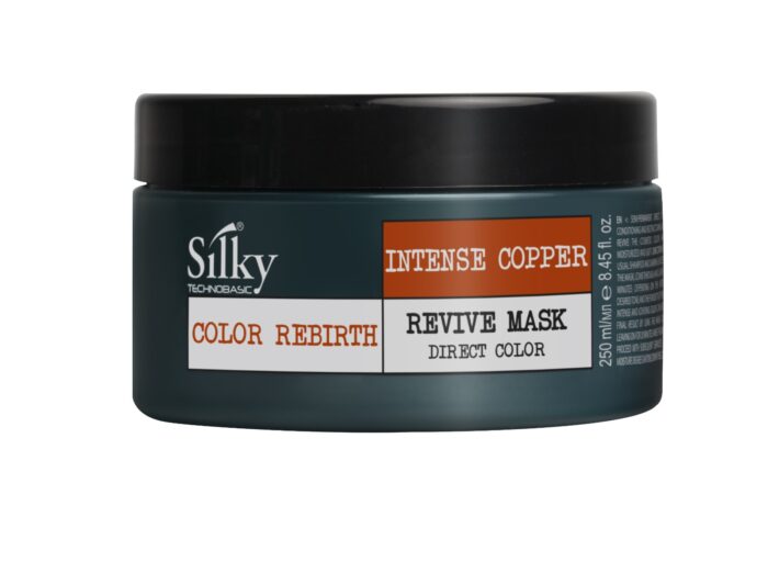 En behållare med SILKY REVIVE MASK DIRECT COLOR COPPER 250ML, för kvinnor, har en mörk design med en orange och vit etikett som visar produktnamnet och volymen (8,45 fl.oz/250 ml), vilket återspeglar Silky Sveriges engagemang för hårprodukter av hög kvalitet.